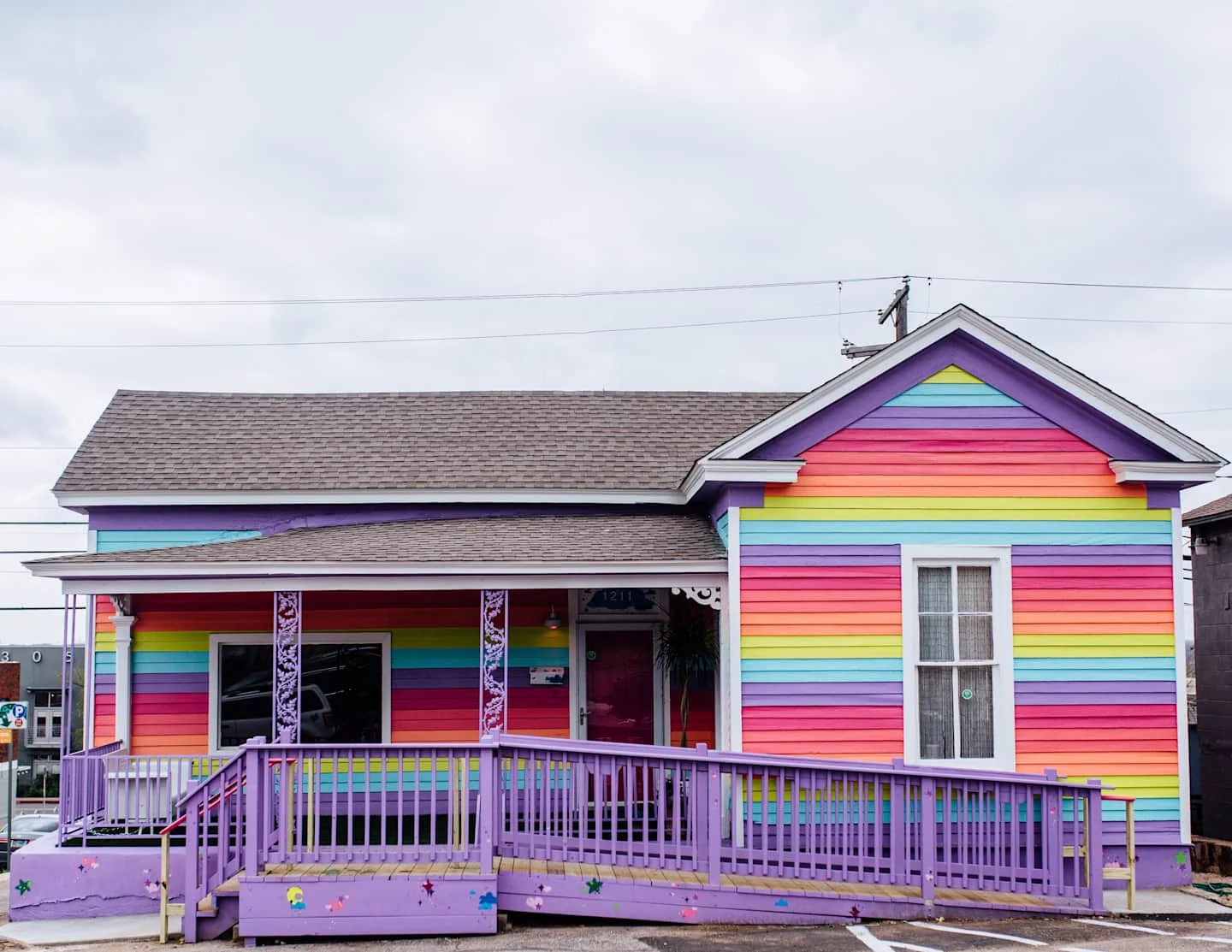 Rainbow-striped Austin bungalow with a purple front porch — Cute Nail Studio, East Austin, Texas