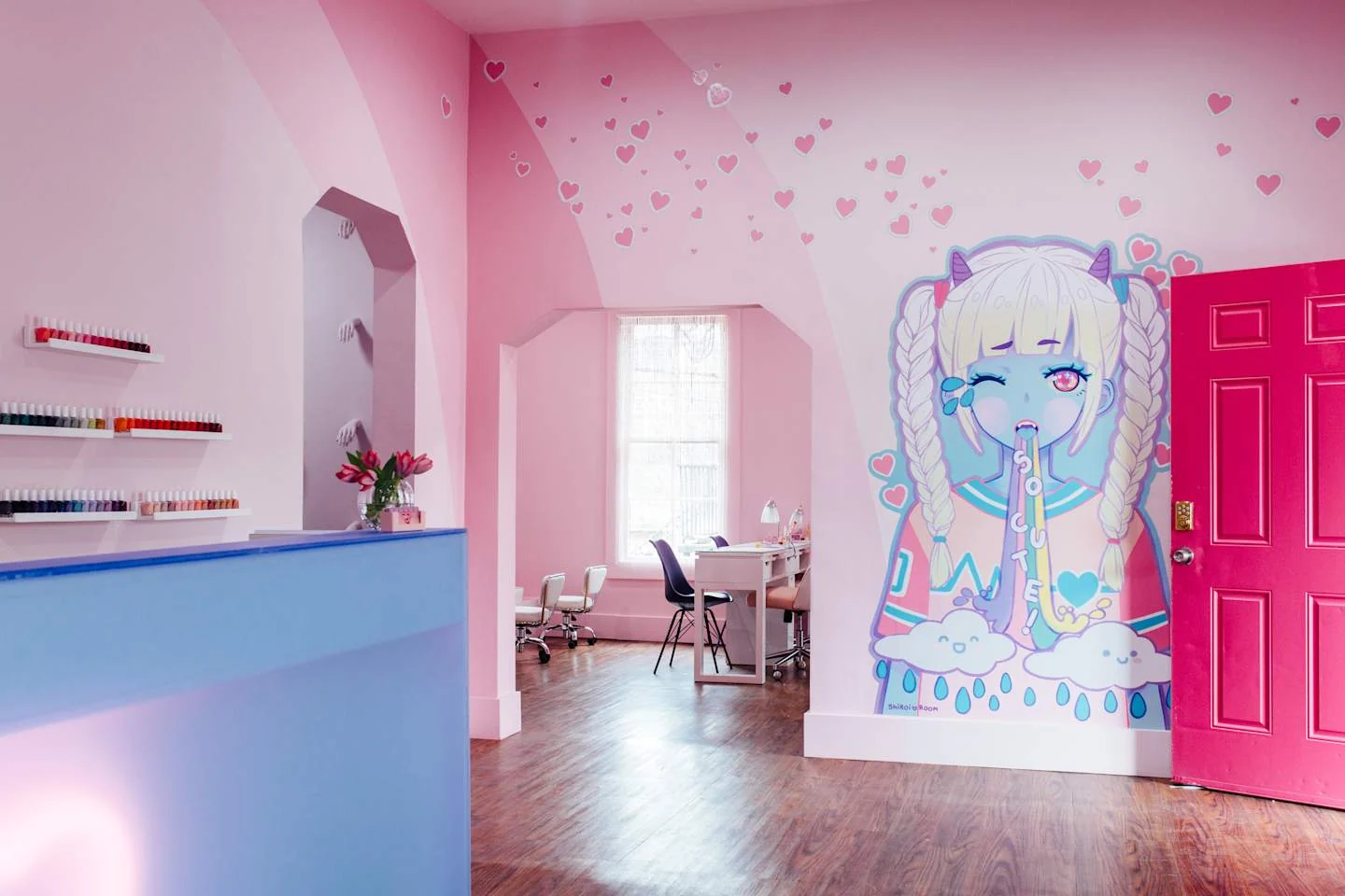 Salon reception with a lavender counter, pink walls and portrait mural — Cute Nail Studio, East Austin, Texas
