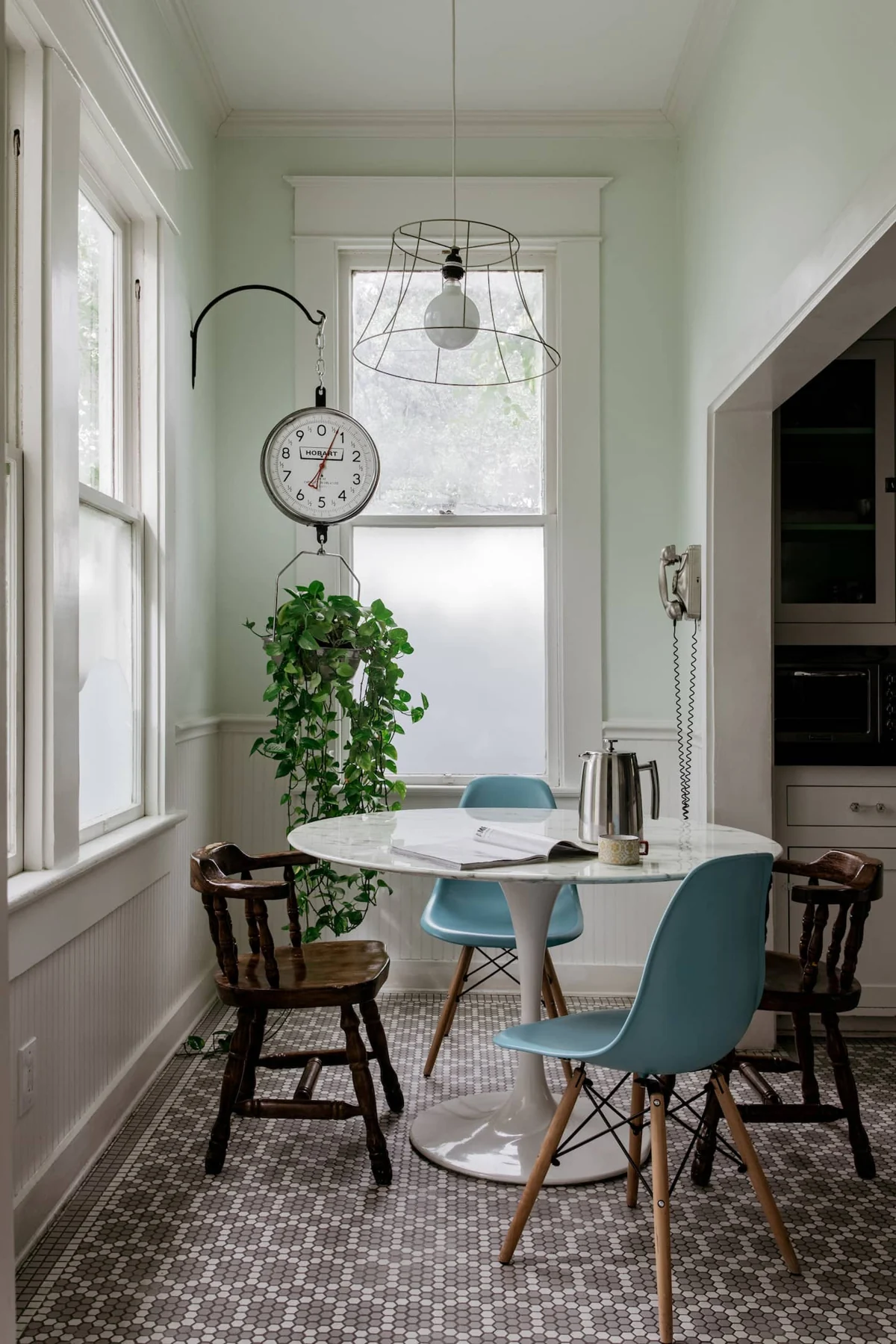 Bright breakfast nook with a small round table and blue chair — Navasota, Austin, Texas