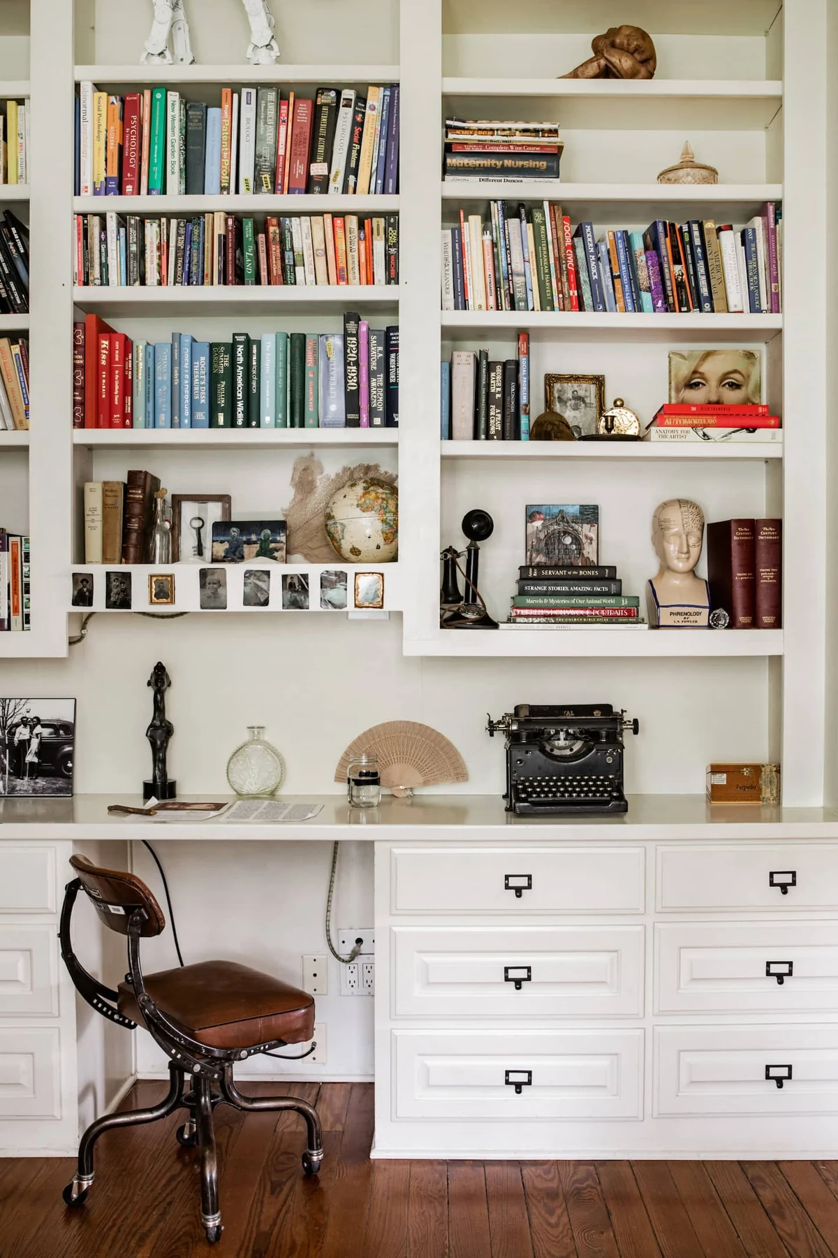 Built-in white bookshelves above a writing desk — Navasota, Austin, Texas
