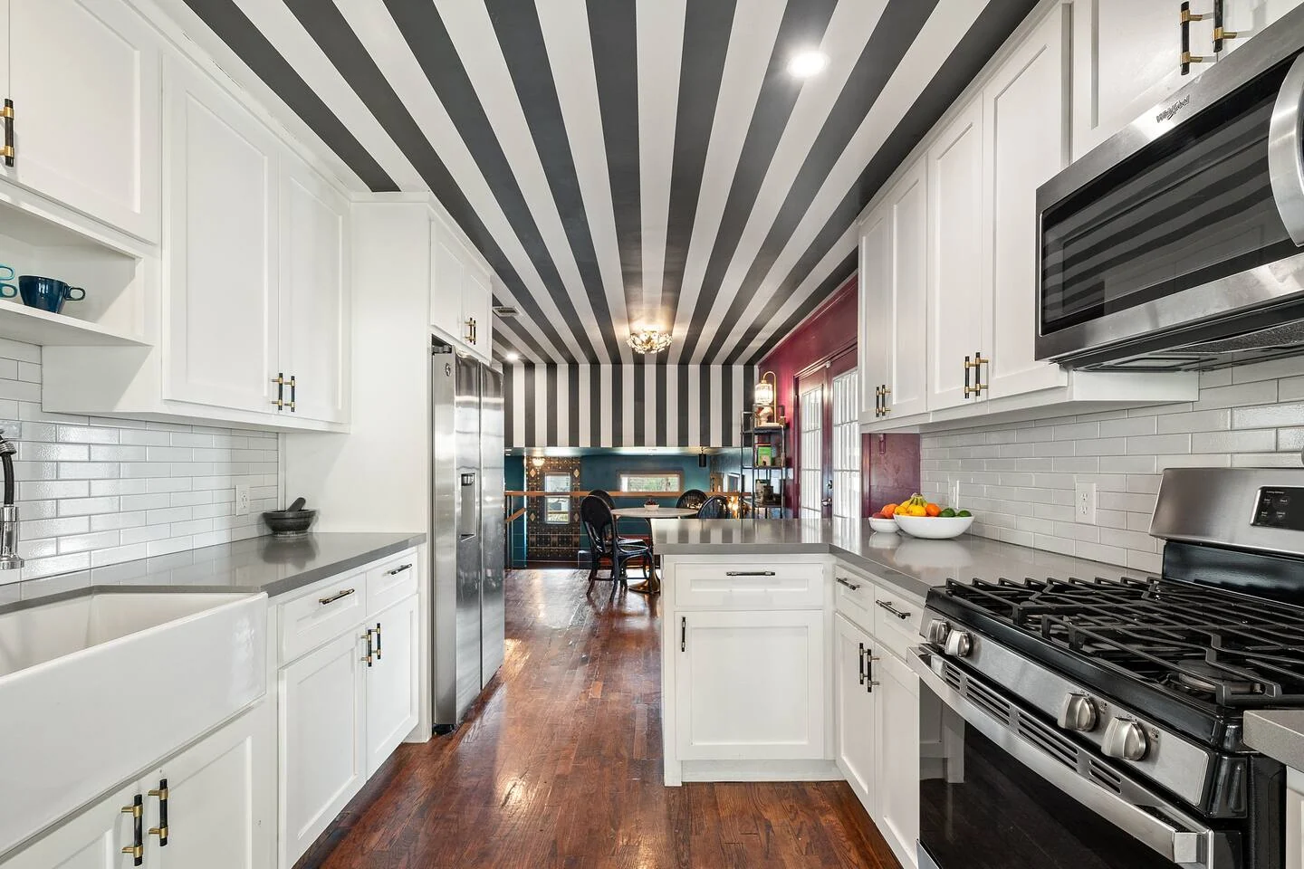 White kitchen with a bold black-and-white striped ceiling — Oak Springs, Austin, Texas