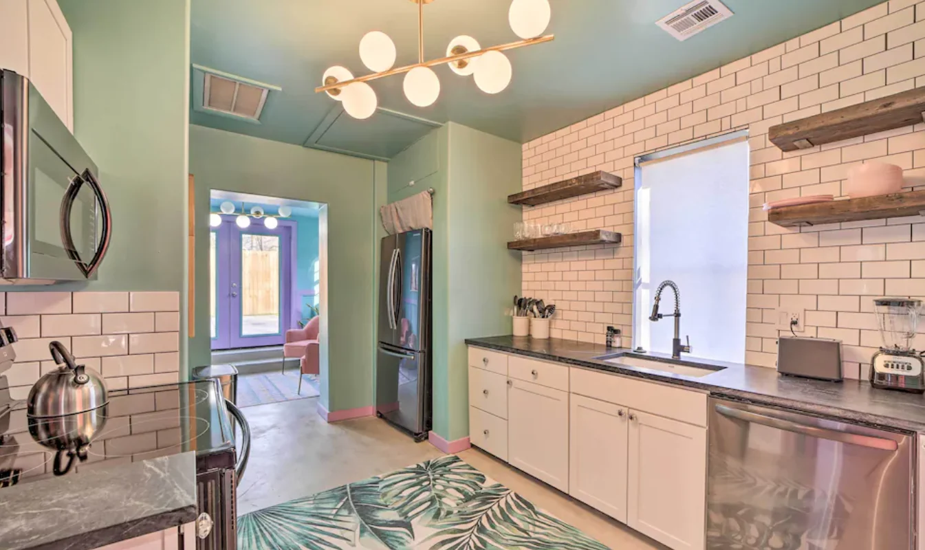 Kitchen with white subway tile, open shelves and patterned flooring — Tulsa Birdcage, Tulsa, Oklahoma