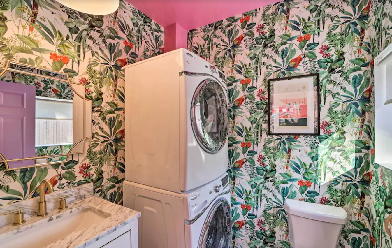 Laundry and powder room wrapped in tropical floral wallpaper — Tulsa Birdcage, Tulsa, Oklahoma