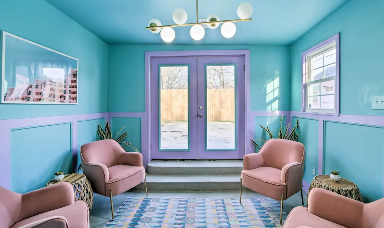 Turquoise sitting room with pink armchairs and patterned tile — Tulsa Birdcage, Tulsa, Oklahoma